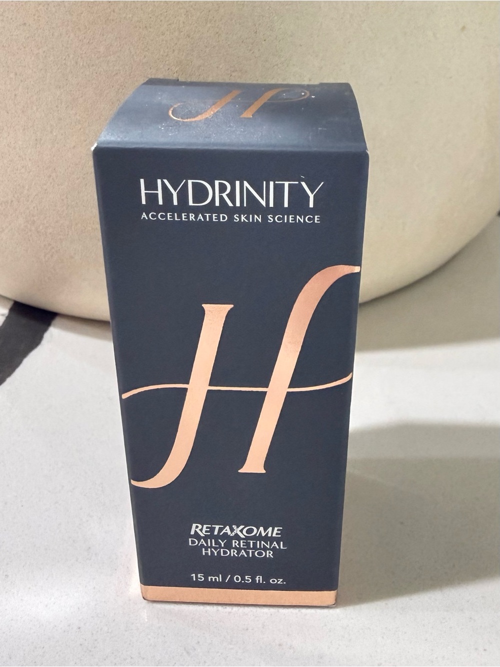 Hydrinity Retaxome Daily Retinal Hydrator - Rose Gold on Navy